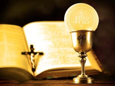 Daily scripture reading image with host, chalice and bible.